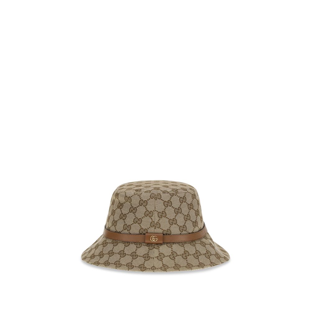 Beige Polyester Bucket HatThe GG Supreme fabric Bucket Hat by Gucci combines style and functionality in a distinctive accessory. Made of GG fabric, it is enhanced by a leather strap with GG detail and completed with an inner lining, for a model that combi
