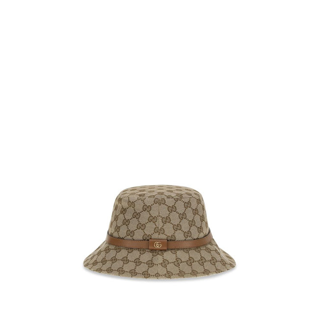 Beige Polyester Bucket HatThe GG Supreme fabric Bucket Hat by Gucci combines style and functionality in a distinctive accessory. Made of GG fabric, it is enhanced by a leather strap with GG detail and completed with an inner lining, for a model that combi