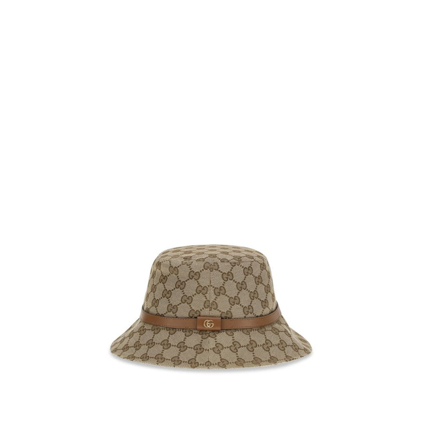 Beige Polyester Bucket HatThe GG Supreme fabric Bucket Hat by Gucci combines style and functionality in a distinctive accessory. Made of GG fabric, it is enhanced by a leather strap with GG detail and completed with an inner lining, for a model that combi