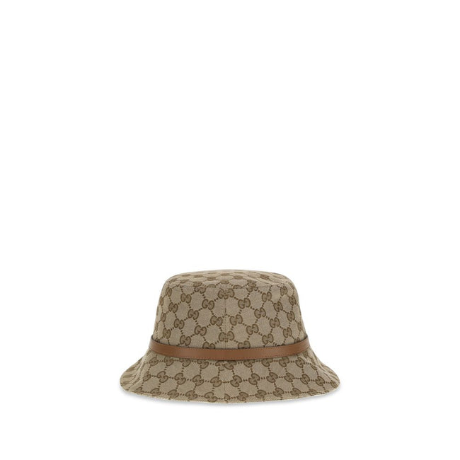 Beige Polyester Bucket HatThe GG Supreme fabric Bucket Hat by Gucci combines style and functionality in a distinctive accessory. Made of GG fabric, it is enhanced by a leather strap with GG detail and completed with an inner lining, for a model that combi