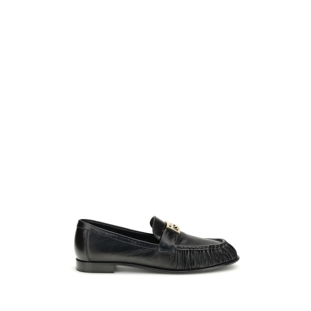 Black Calf Leather Bos Taurus Slip-On LoafersThe nappa Baguette Loafers by Fendi are a perfect example of timeless elegance and Italian craftsmanship. Crafted from soft nappa leather, they’re embellished with the iconic FF metal detail on the vamp, the Ma