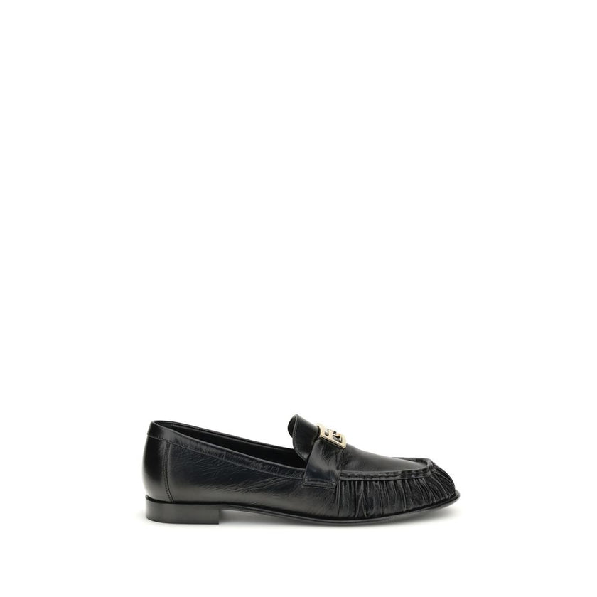 Black Calf Leather Bos Taurus Slip-On LoafersThe nappa Baguette Loafers by Fendi are a perfect example of timeless elegance and Italian craftsmanship. Crafted from soft nappa leather, they’re embellished with the iconic FF metal detail on the vamp, the Ma