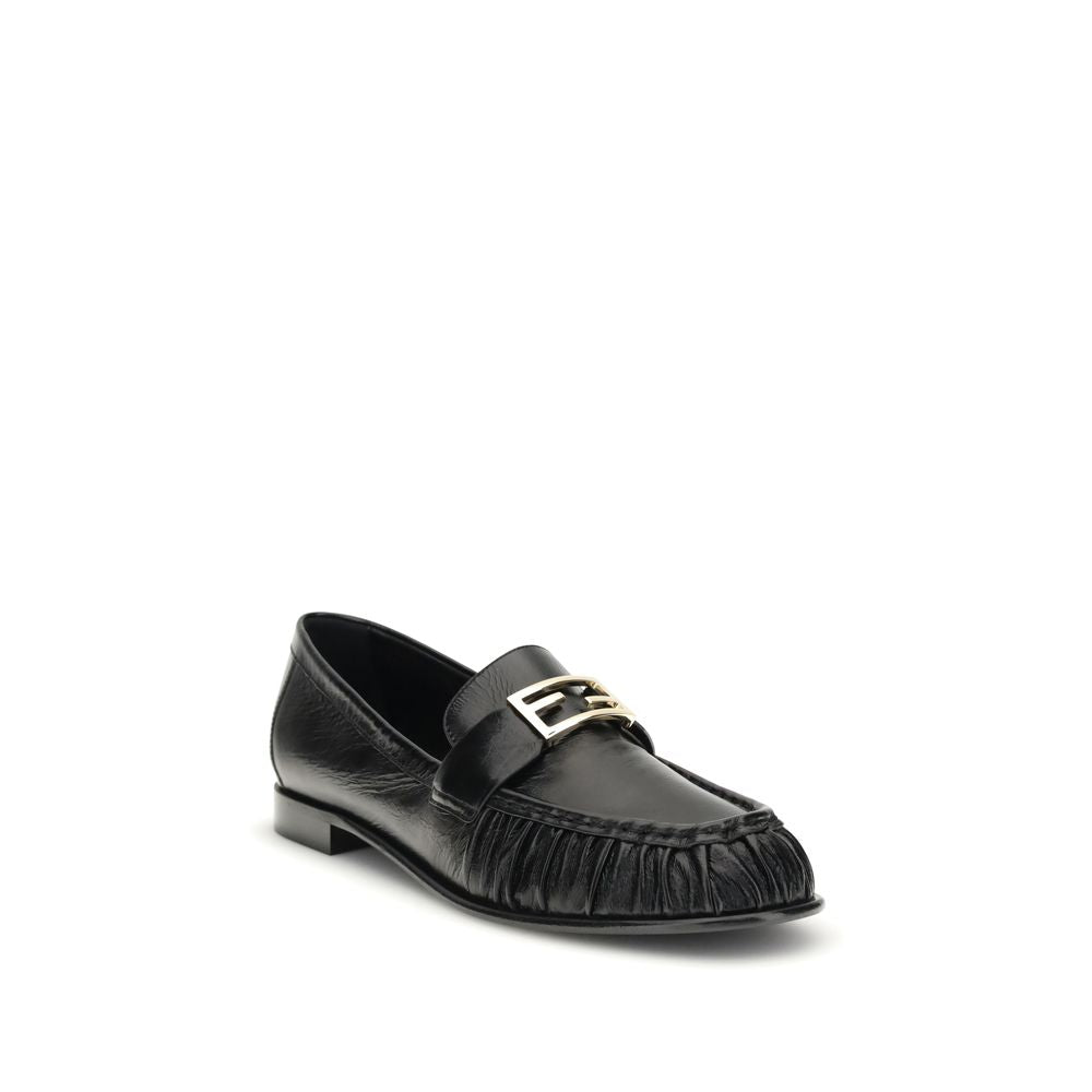 Black Calf Leather Bos Taurus Slip-On LoafersThe nappa Baguette Loafers by Fendi are a perfect example of timeless elegance and Italian craftsmanship. Crafted from soft nappa leather, they’re embellished with the iconic FF metal detail on the vamp, the Ma