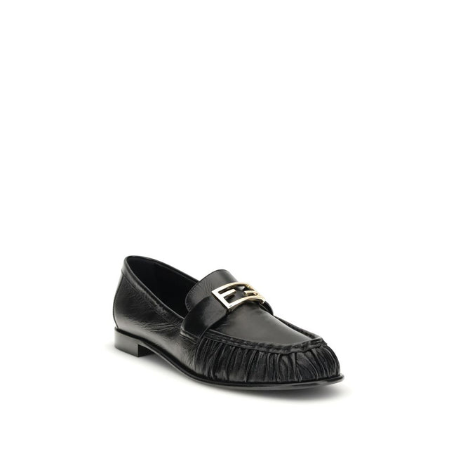 Black Calf Leather Bos Taurus Slip-On LoafersThe nappa Baguette Loafers by Fendi are a perfect example of timeless elegance and Italian craftsmanship. Crafted from soft nappa leather, they’re embellished with the iconic FF metal detail on the vamp, the Ma