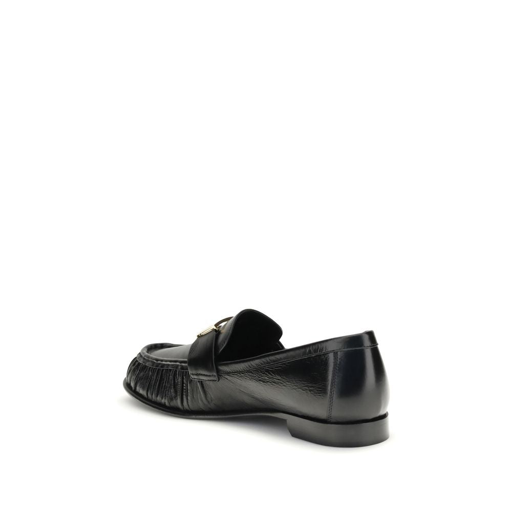 Black Calf Leather Bos Taurus Slip-On LoafersThe nappa Baguette Loafers by Fendi are a perfect example of timeless elegance and Italian craftsmanship. Crafted from soft nappa leather, they’re embellished with the iconic FF metal detail on the vamp, the Ma