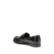 Black Calf Leather Bos Taurus Slip-On LoafersThe nappa Baguette Loafers by Fendi are a perfect example of timeless elegance and Italian craftsmanship. Crafted from soft nappa leather, they’re embellished with the iconic FF metal detail on the vamp, the Ma