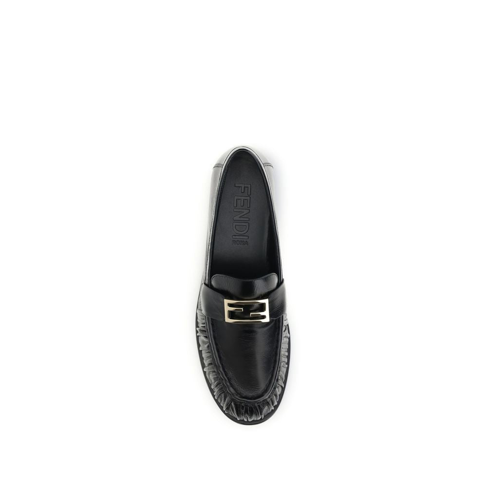 Black Calf Leather Bos Taurus Slip-On LoafersThe nappa Baguette Loafers by Fendi are a perfect example of timeless elegance and Italian craftsmanship. Crafted from soft nappa leather, they’re embellished with the iconic FF metal detail on the vamp, the Ma