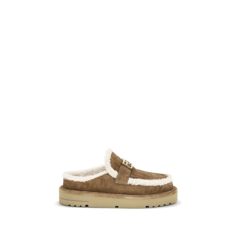 Beige Leather MulesThe Après Chic sheepskin Mules by Fendi combine comfort and style in a sophisticated design. Made of brown suede with a tone-on-tone embossed FF pattern, they feature an inner lining and white sheepskin trim that add softness and warmth