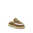 Beige Leather MulesThe Après Chic sheepskin Mules by Fendi combine comfort and style in a sophisticated design. Made of brown suede with a tone-on-tone embossed FF pattern, they feature an inner lining and white sheepskin trim that add softness and warmth