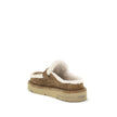 Beige Leather MulesThe Après Chic sheepskin Mules by Fendi combine comfort and style in a sophisticated design. Made of brown suede with a tone-on-tone embossed FF pattern, they feature an inner lining and white sheepskin trim that add softness and warmth