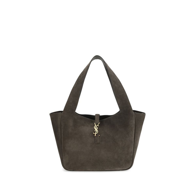 Brown Calf Leather Bos Taurus Shoulder BagThe Le 5 à 7 Bea Tote Bag by Saint Laurent, made of suede leather, is an elegant versatile accessory with a refined design. The closure features a strap with a Cassandre logo plaque and a snap button, giving it a