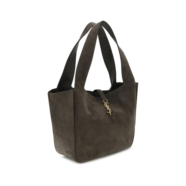 Brown Calf Leather Bos Taurus Shoulder BagThe Le 5 à 7 Bea Tote Bag by Saint Laurent, made of suede leather, is an elegant versatile accessory with a refined design. The closure features a strap with a Cassandre logo plaque and a snap button, giving it a