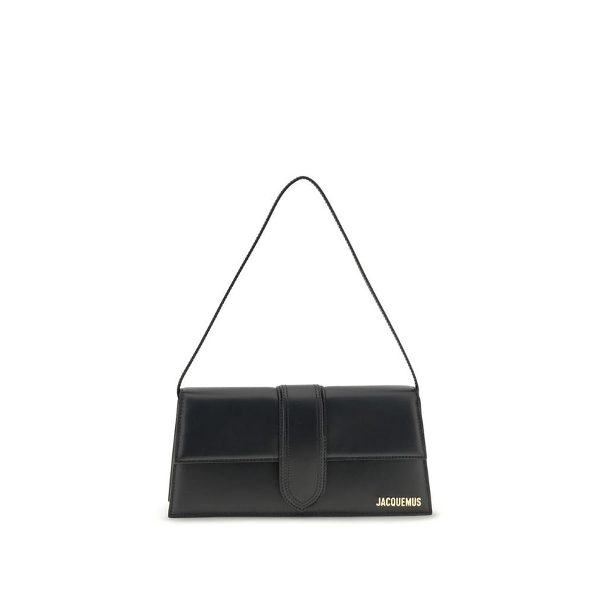 Black Calf Leather Bos Taurus Shoulder BagThe Le Bambino Long Shoulder Bag by Jacquemus is a sophisticated accessory that combines contemporary elegance and functionality. Featuring a flat top handle and an adjustable and removable shoulder strap, it offe