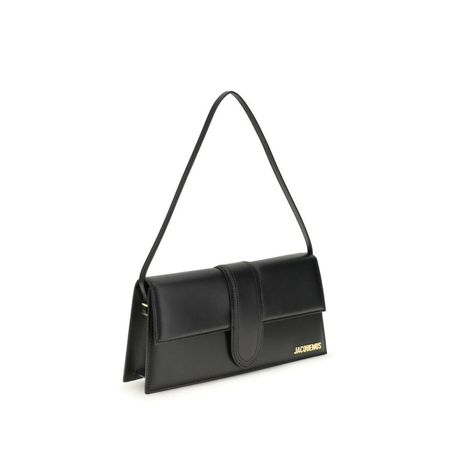 Black Calf Leather Bos Taurus Shoulder BagThe Le Bambino Long Shoulder Bag by Jacquemus is a sophisticated accessory that combines contemporary elegance and functionality. Featuring a flat top handle and an adjustable and removable shoulder strap, it offe
