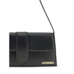 Black Calf Leather Bos Taurus Shoulder BagThe Le Bambino Long Shoulder Bag by Jacquemus is a sophisticated accessory that combines contemporary elegance and functionality. Featuring a flat top handle and an adjustable and removable shoulder strap, it offe