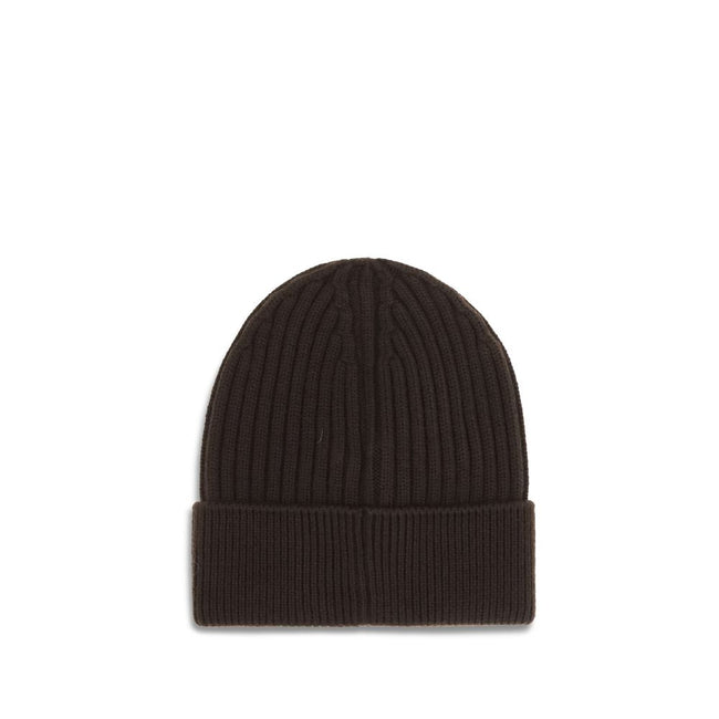 Black Fleece Wool BeanieBeanie Hat by Moncler Grenoble combines functionality and style in an essential cold-weather accessory. Made with ribbed fabrication, it offers a snug and comfortable fit. The Moncler Grenoble logo sewn on the front adds a distinct
