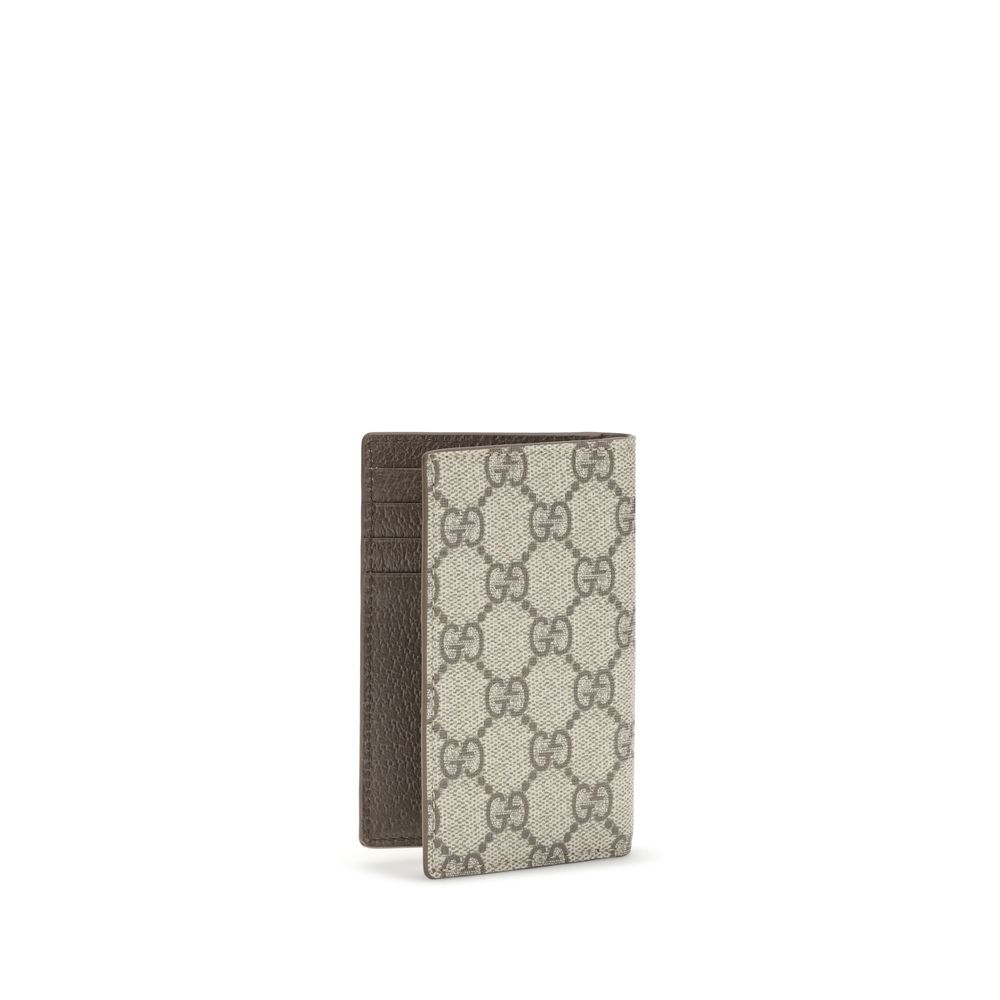 Beige Cotton WalletGucci’s long Card Holder is a practical and refined accessory designed for those looking for high organization capacity without sacrificing style. With ten card slots and two bill slots, it offers ample space to keep all your cards and