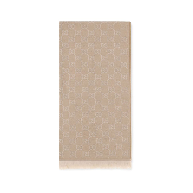 Beige Wool ScarfThe GG Supreme embroidered wool Scarf by Gucci combines warmth and sophistication in a distinctive Maison accessory. Made of pure wool, it features GG embroidery across the entire surface, while frayed ends complete the design with a touch