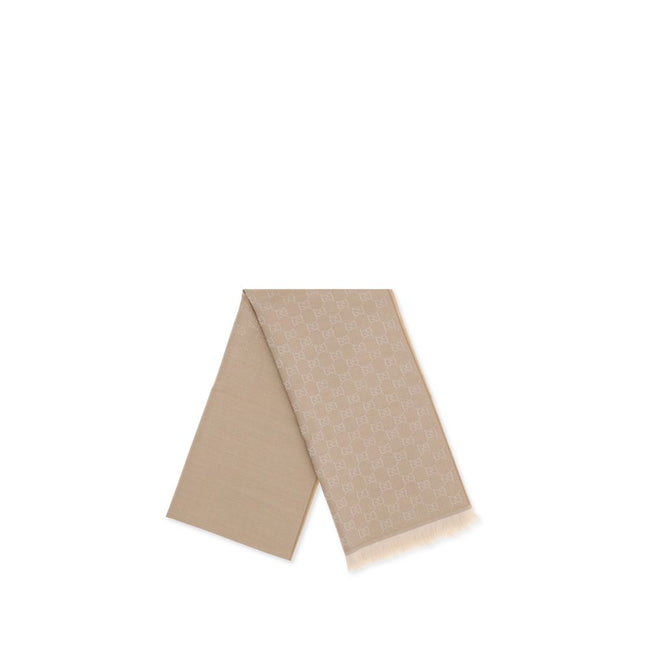 Beige Wool ScarfThe GG Supreme embroidered wool Scarf by Gucci combines warmth and sophistication in a distinctive Maison accessory. Made of pure wool, it features GG embroidery across the entire surface, while frayed ends complete the design with a touch