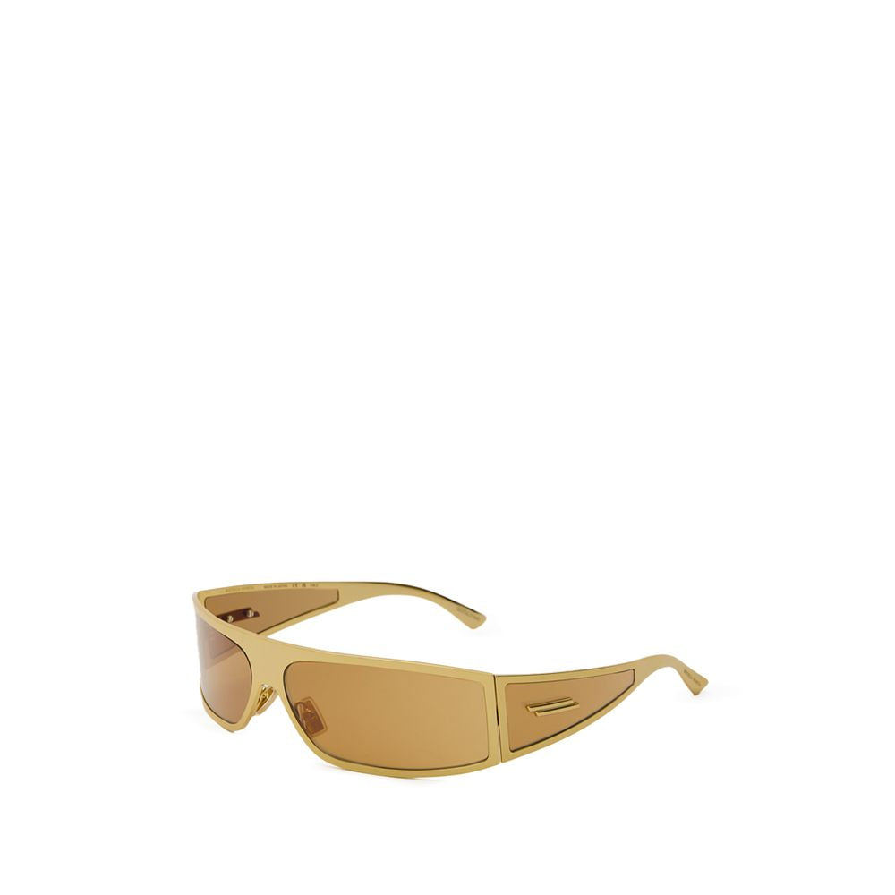 Gold Metal SunglassesBottega Veneta Gold Metal Wraparound Sunglasses. Rectangular wraparound gold metal frame, ochre lenses, and temple details. Composition: Metal Internal SKU: 25AGO37 Brand SKU: 769241V44501431Gold Metal Sunglasses${tagsBottega VenetaGo