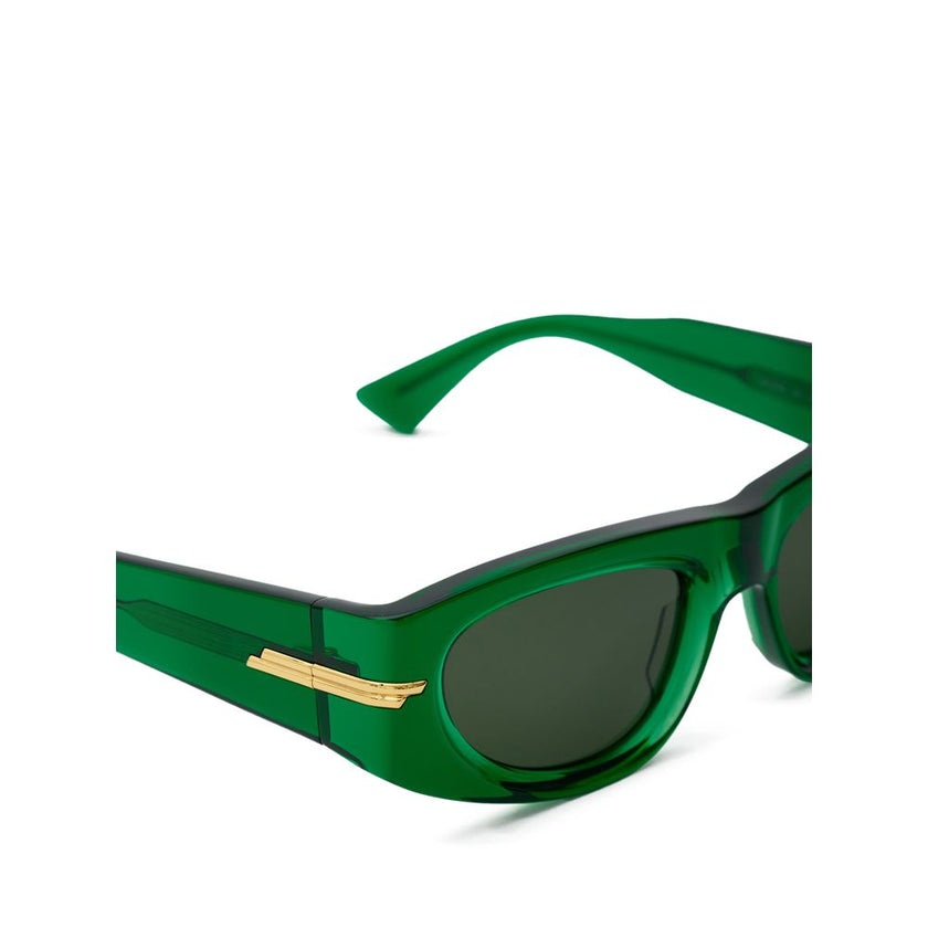 Green Acetate SunglassesBottega Veneta Transparent Green Acetate Sunglasses. Geometric frame, dark green lenses, gold details on the arms. Composition: Acetate Internal SKU: 25AGO34 Brand SKU: 703257V23303354Green Acetate Sunglasses${tagsBottega VenetaGre
