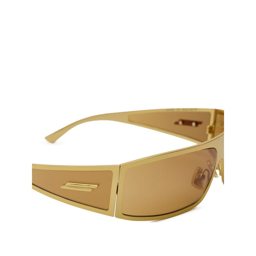 Gold Metal SunglassesBottega Veneta Gold Metal Wraparound Sunglasses. Rectangular wraparound gold metal frame, ochre lenses, and temple details. Composition: Metal Internal SKU: 25AGO37 Brand SKU: 769241V44501431Gold Metal Sunglasses${tagsBottega VenetaGo