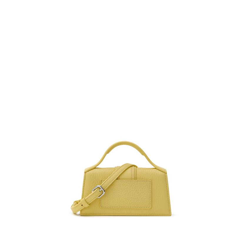 Yellow Leather HandbagJacquemus Yellow Hammered Leather Le Mini Bambino Bag. Shoulder bag with adjustable and removable shoulder strap, single handle, front opening with flap and covered magnetic button, single internal compartment and pocket, silver meta
