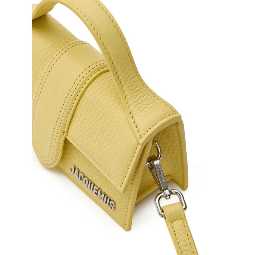 Yellow Leather HandbagJacquemus Yellow Hammered Leather Le Mini Bambino Bag. Shoulder bag with adjustable and removable shoulder strap, single handle, front opening with flap and covered magnetic button, single internal compartment and pocket, silver meta