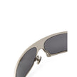 Gray Metal SunglassesBottega Veneta Silver Metal Wraparound Sunglasses. Rectangular wraparound gold metal frame, dark gray lenses, and temple details. Composition: Metal Internal SKU: 25AGO38 Brand SKU: 769241V44508107Gray Metal Sunglasses${tagsBottega Ve