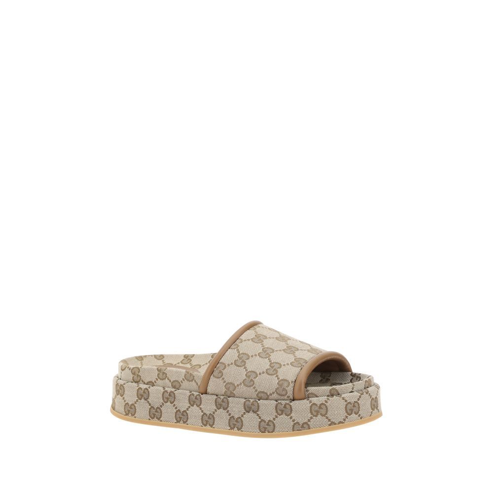Beige Polyamide Platform SandalsModern design with platform style Offers comfort without sacrificing style Flat sole provides stability Leather trim adds a touch of elegance Iconic all over GG Supreme pattern Recognizable and sophisticated detail Perfect