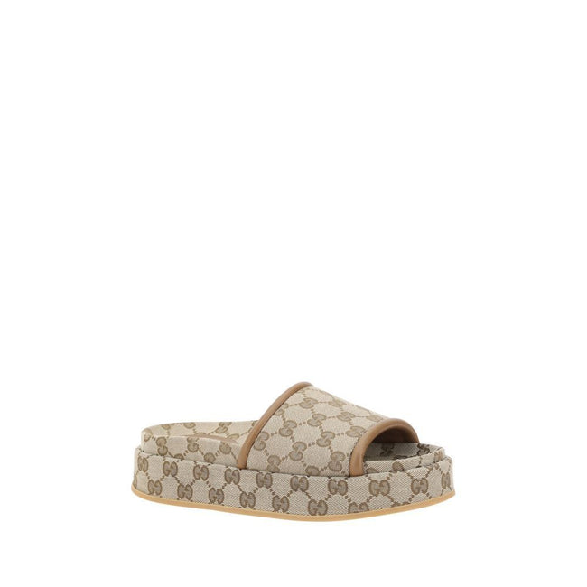 Beige Polyamide Platform SandalsModern design with platform style Offers comfort without sacrificing style Flat sole provides stability Leather trim adds a touch of elegance Iconic all over GG Supreme pattern Recognizable and sophisticated detail Perfect
