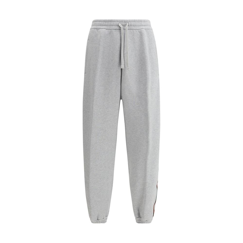 Gray Cotton Joggers (Workout Pants)Gucci’s Cotton Sweatpants are a perfect example of sporty elegance. Featuring side bands in the brand’s iconic colors, they add a distinctive and recognizable touch to the design. The iconic Gucci monogram is stitched on