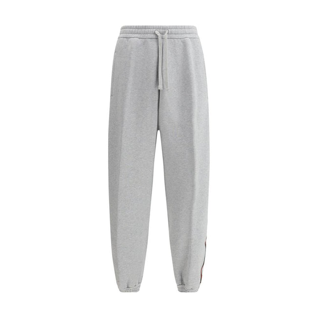 Gray Cotton Joggers (Workout Pants)Gucci’s Cotton Sweatpants are a perfect example of sporty elegance. Featuring side bands in the brand’s iconic colors, they add a distinctive and recognizable touch to the design. The iconic Gucci monogram is stitched on