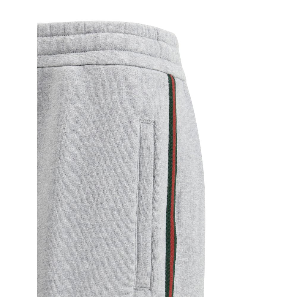 Gray Cotton Joggers (Workout Pants)Gucci’s Cotton Sweatpants are a perfect example of sporty elegance. Featuring side bands in the brand’s iconic colors, they add a distinctive and recognizable touch to the design. The iconic Gucci monogram is stitched on