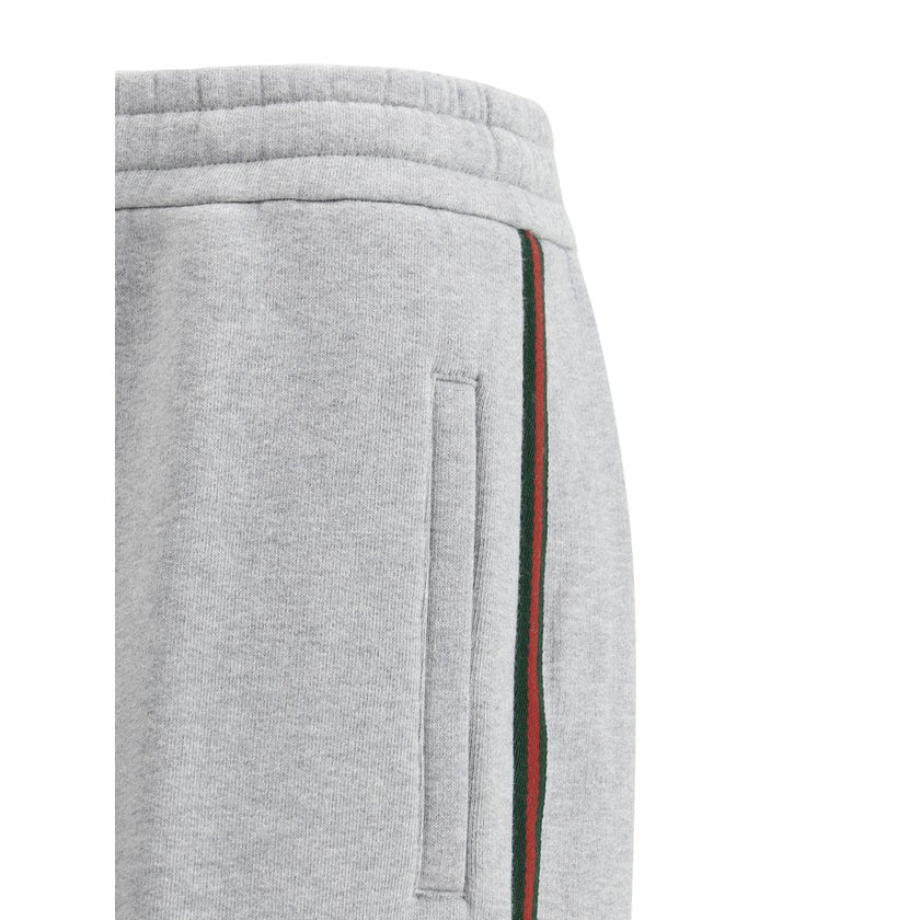 Gray Cotton Joggers (Workout Pants)Gucci’s Cotton Sweatpants are a perfect example of sporty elegance. Featuring side bands in the brand’s iconic colors, they add a distinctive and recognizable touch to the design. The iconic Gucci monogram is stitched on