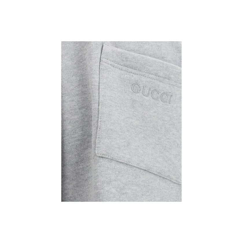 Gray Cotton Joggers (Workout Pants)Gucci’s Cotton Sweatpants are a perfect example of sporty elegance. Featuring side bands in the brand’s iconic colors, they add a distinctive and recognizable touch to the design. The iconic Gucci monogram is stitched on