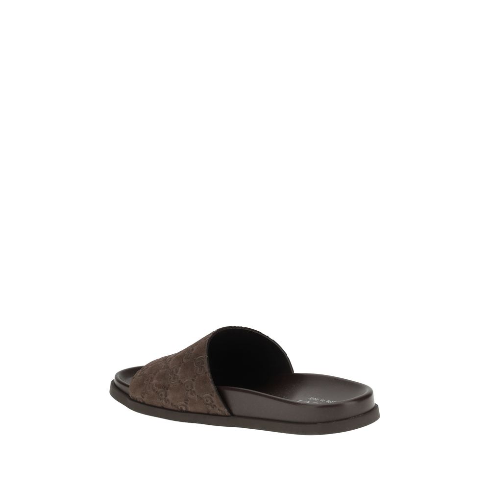 Brown Calf Leather Bos Taurus Flat SandalsGucci’s Slider Sandals feature the GG motif, which adds a distinctive touch to the design. The soft suede upper lends a refined air, while the contoured sole ensures extended comfort and a snug fit. Ideal for thos