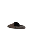 Brown Calf Leather Bos Taurus Flat SandalsGucci’s Slider Sandals feature the GG motif, which adds a distinctive touch to the design. The soft suede upper lends a refined air, while the contoured sole ensures extended comfort and a snug fit. Ideal for thos