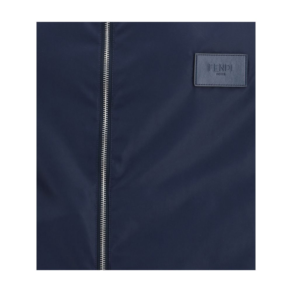 Blue Polyester Shell JacketReversible waterproof Jacket by Fendi, designed to combine functionality and iconic style. The model features an adjustable hood with drawstring, front closure with double-slider zipper, two side welt pockets, elastic cuffs and