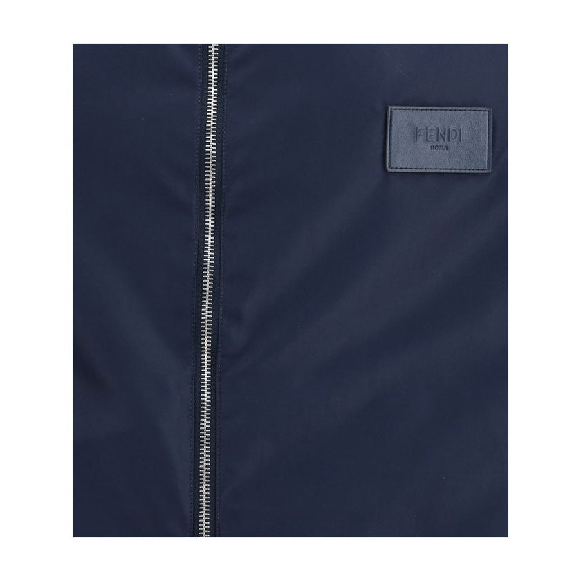 Blue Polyester Shell JacketReversible waterproof Jacket by Fendi, designed to combine functionality and iconic style. The model features an adjustable hood with drawstring, front closure with double-slider zipper, two side welt pockets, elastic cuffs and