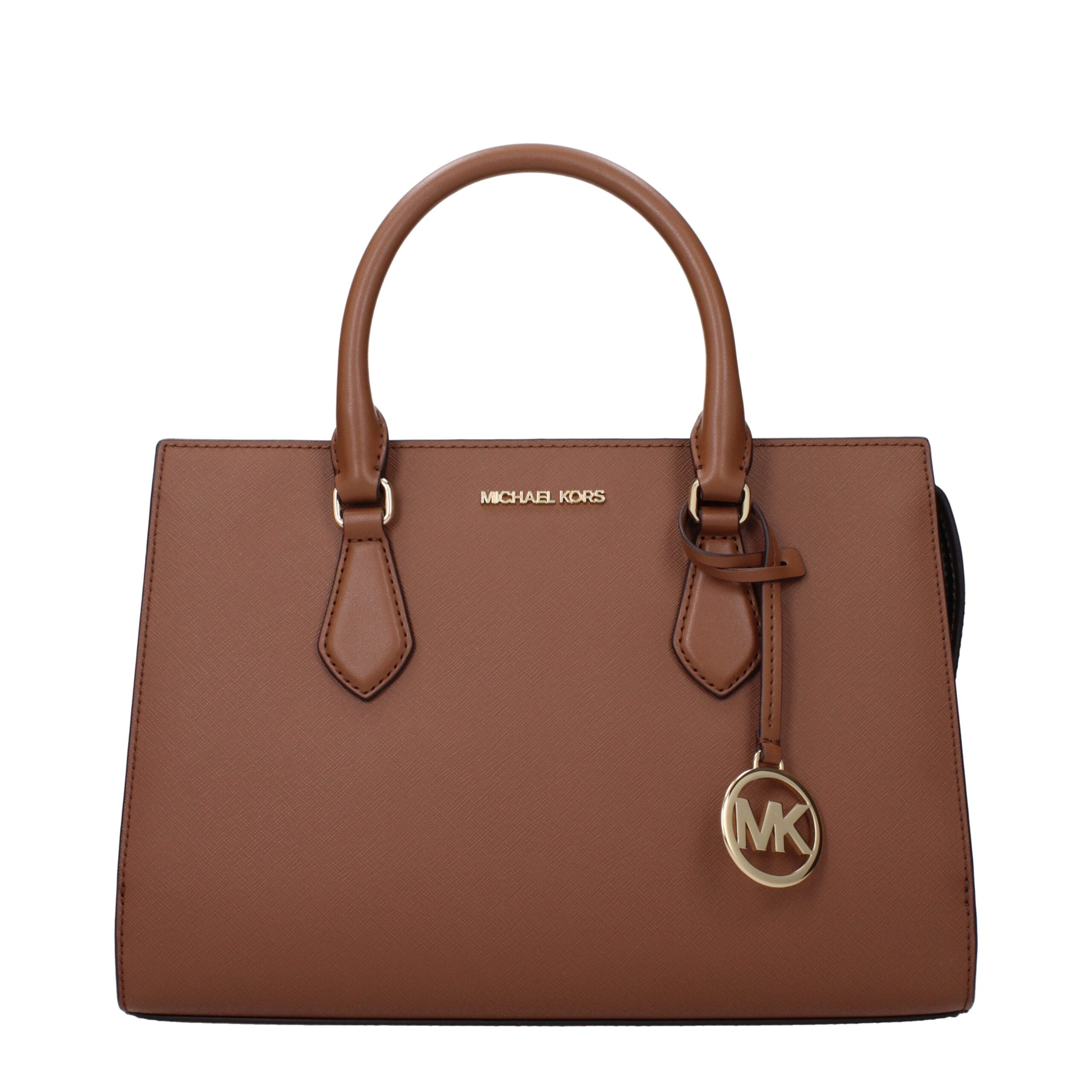 Brown Fabric HandbagDescription: The product with MPN 35S3G6HS2LLUGGAGE and code F85169 fabric in brown is a handbags designed by Michael Kors. It has features like front logo, removable details, adjustable shoulder, removable shoulder, divider inner pock