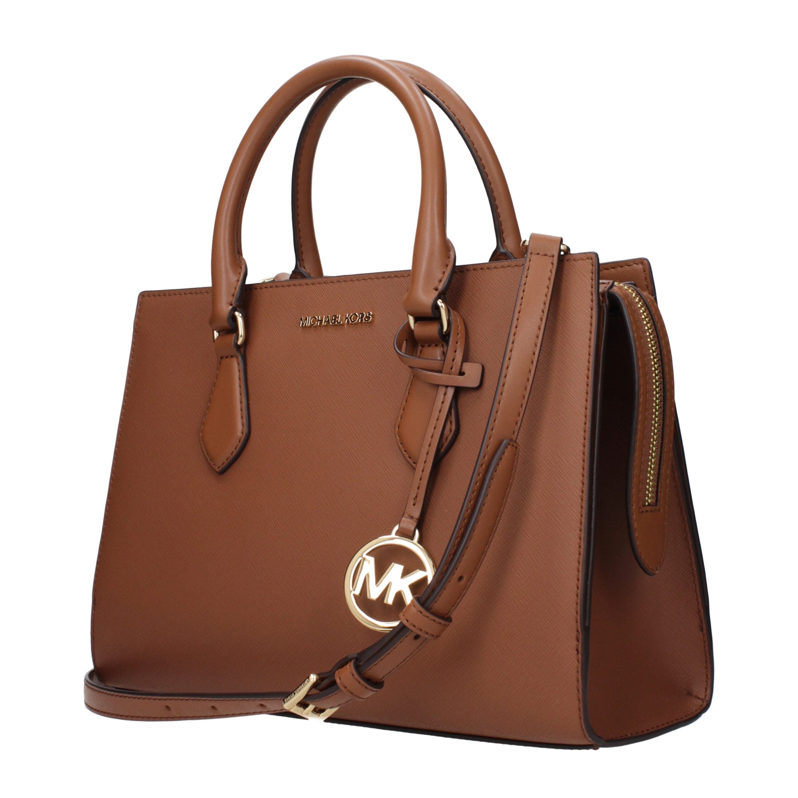 Brown Fabric HandbagDescription: The product with MPN 35S3G6HS2LLUGGAGE and code F85169 fabric in brown is a handbags designed by Michael Kors. It has features like front logo, removable details, adjustable shoulder, removable shoulder, divider inner pock
