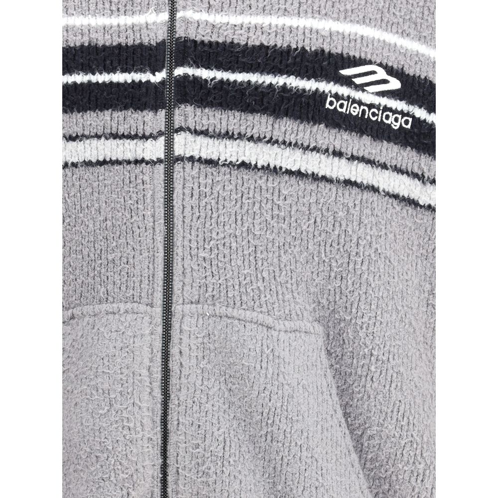 Multicolor Cotton SweatshirtThe fluffy zip-up Hoodie by Balenciaga is a soft, cozy hooded sweatshirt crafted from plush-effect fabric for a luxurious feel. It features a front zip closure, divided kangaroo pockets, and the Balenciaga logo embroidered on t