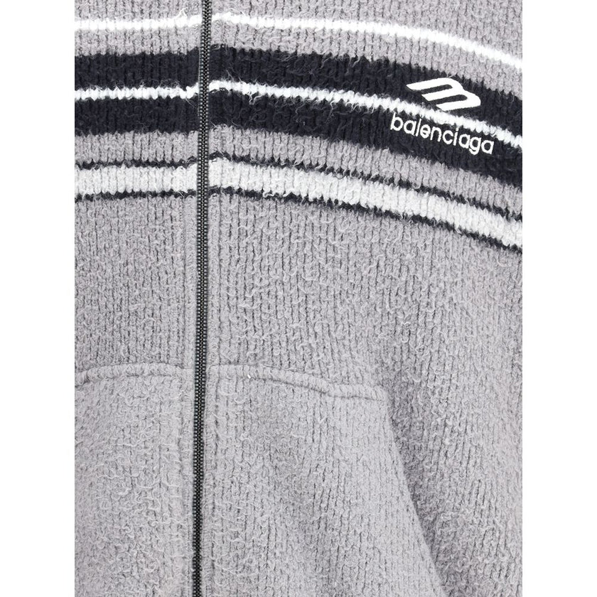 Multicolor Cotton SweatshirtThe fluffy zip-up Hoodie by Balenciaga is a soft, cozy hooded sweatshirt crafted from plush-effect fabric for a luxurious feel. It features a front zip closure, divided kangaroo pockets, and the Balenciaga logo embroidered on t