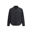Black Polyester ClothingThe padded Jacket by Balenciaga is crafted from high-quality polyester, designed to provide warmth and comfort while maintaining a sleek aesthetic. It features a pointed collar, front button closure, and buttoned cuffs. The tonal e