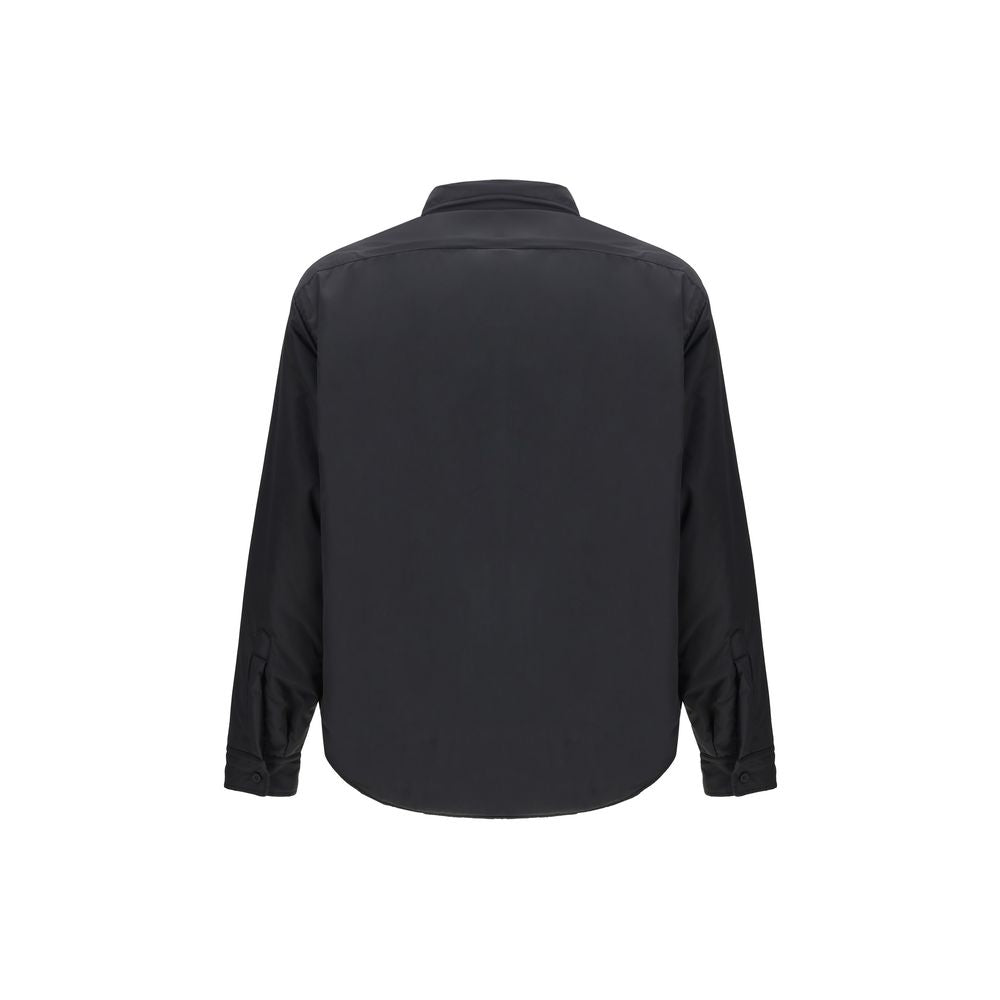 Black Polyester ClothingThe padded Jacket by Balenciaga is crafted from high-quality polyester, designed to provide warmth and comfort while maintaining a sleek aesthetic. It features a pointed collar, front button closure, and buttoned cuffs. The tonal e