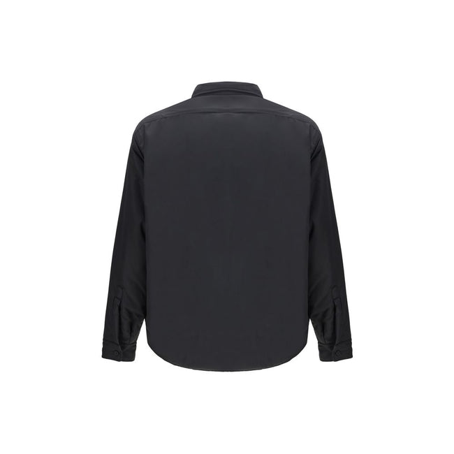 Black Polyester ClothingThe padded Jacket by Balenciaga is crafted from high-quality polyester, designed to provide warmth and comfort while maintaining a sleek aesthetic. It features a pointed collar, front button closure, and buttoned cuffs. The tonal e