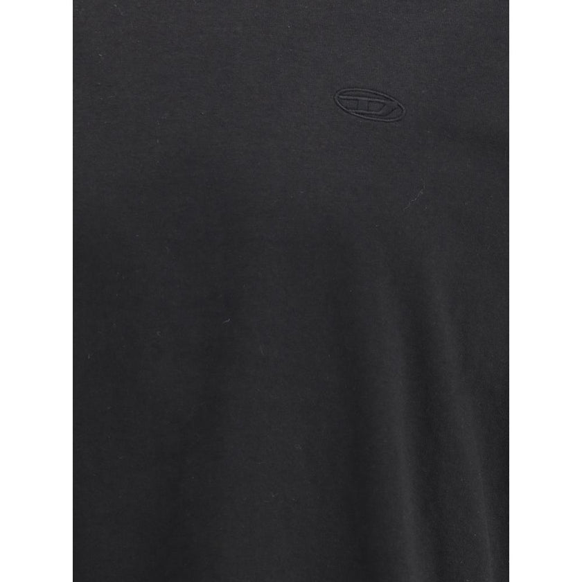 Black Cotton T-ShirtThe T-Boggy-Megoval-D T-shirt by Diesel is crafted from washed organic cotton jersey, featuring a soft, relaxed fit for everyday comfort. Its minimalist design is elevated by a contrasting macro Oval D embroidery on the back and a smal