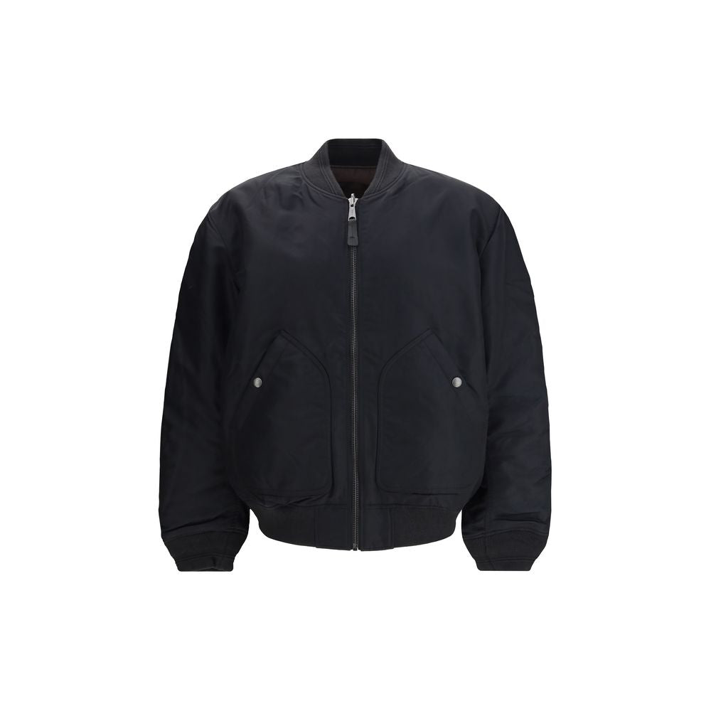 Black Polyamide BomberThe J-Held padded nylon Bomber Jacket by Diesel is crafted from technical fabric made with certified recycled nylon fibers, reflecting the brand’s commitment to sustainability. Lightly padded for warmth and comfort, it features subtl