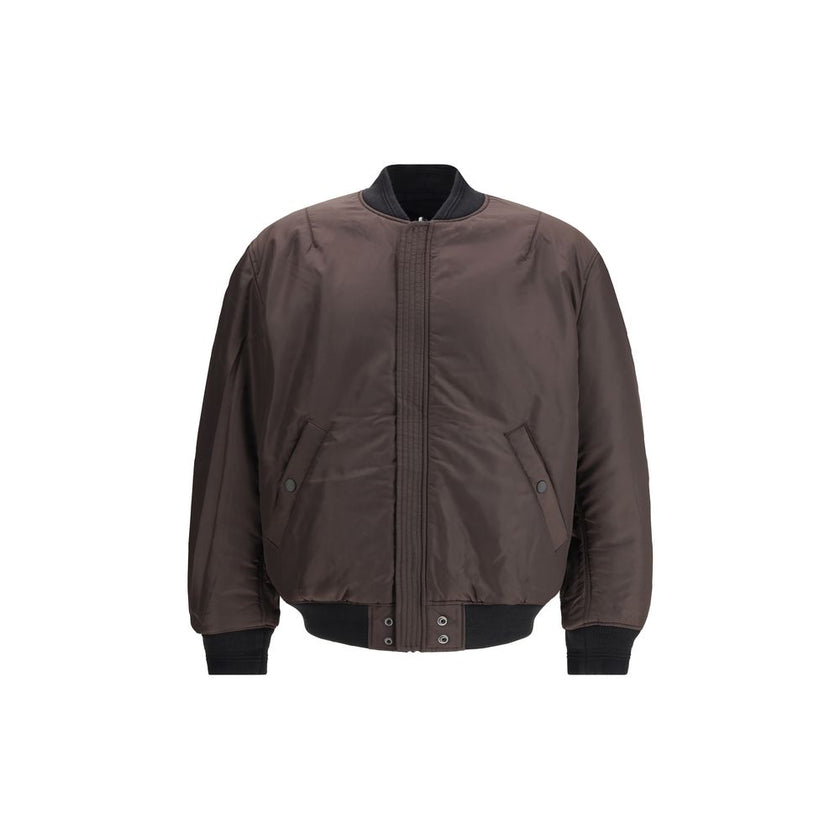 Black Polyamide BomberThe J-Held padded nylon Bomber Jacket by Diesel is crafted from technical fabric made with certified recycled nylon fibers, reflecting the brand’s commitment to sustainability. Lightly padded for warmth and comfort, it features subtl